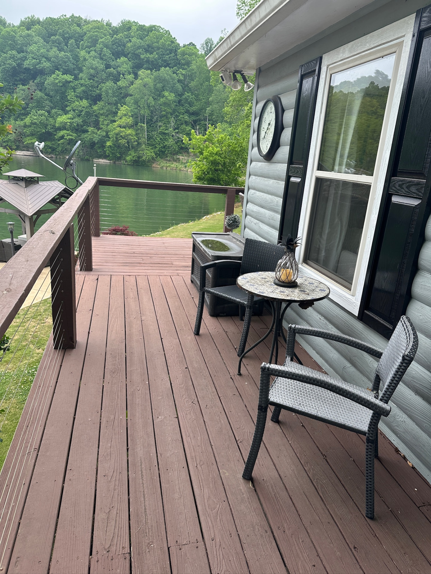 Lakefront deck with seating and open water views