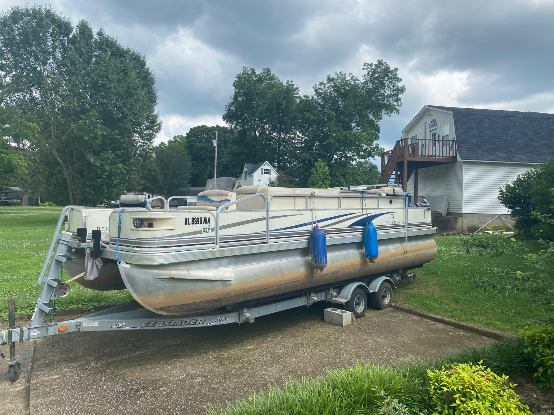 Pontoon boat on its trailer, ready to launch