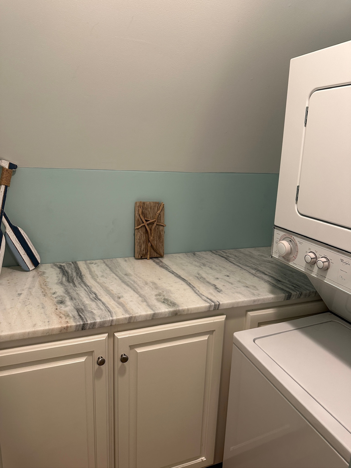 Laundry room with washer, dryer and storage