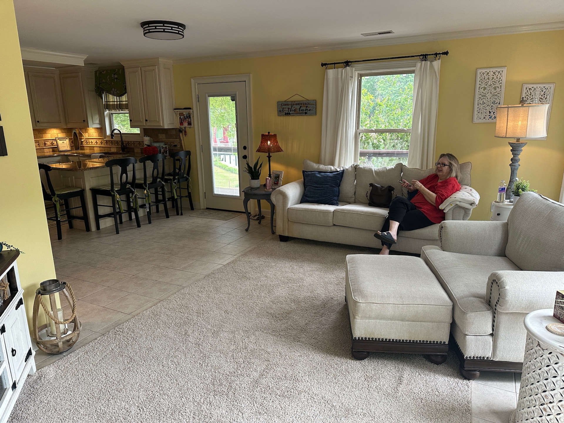 Open living room and kitchen with lake views