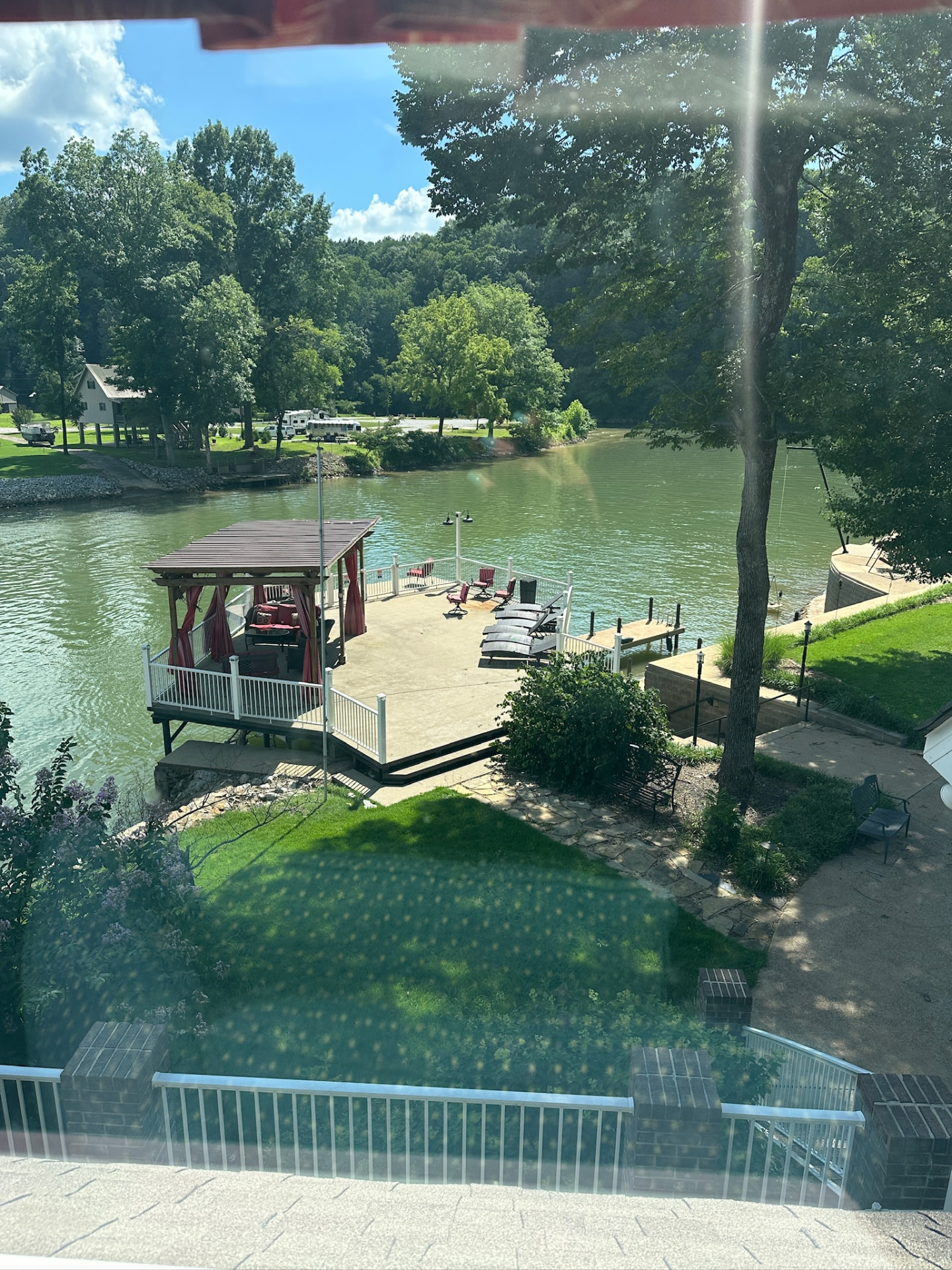Aerial view of the covered dock, lounge chairs and open water