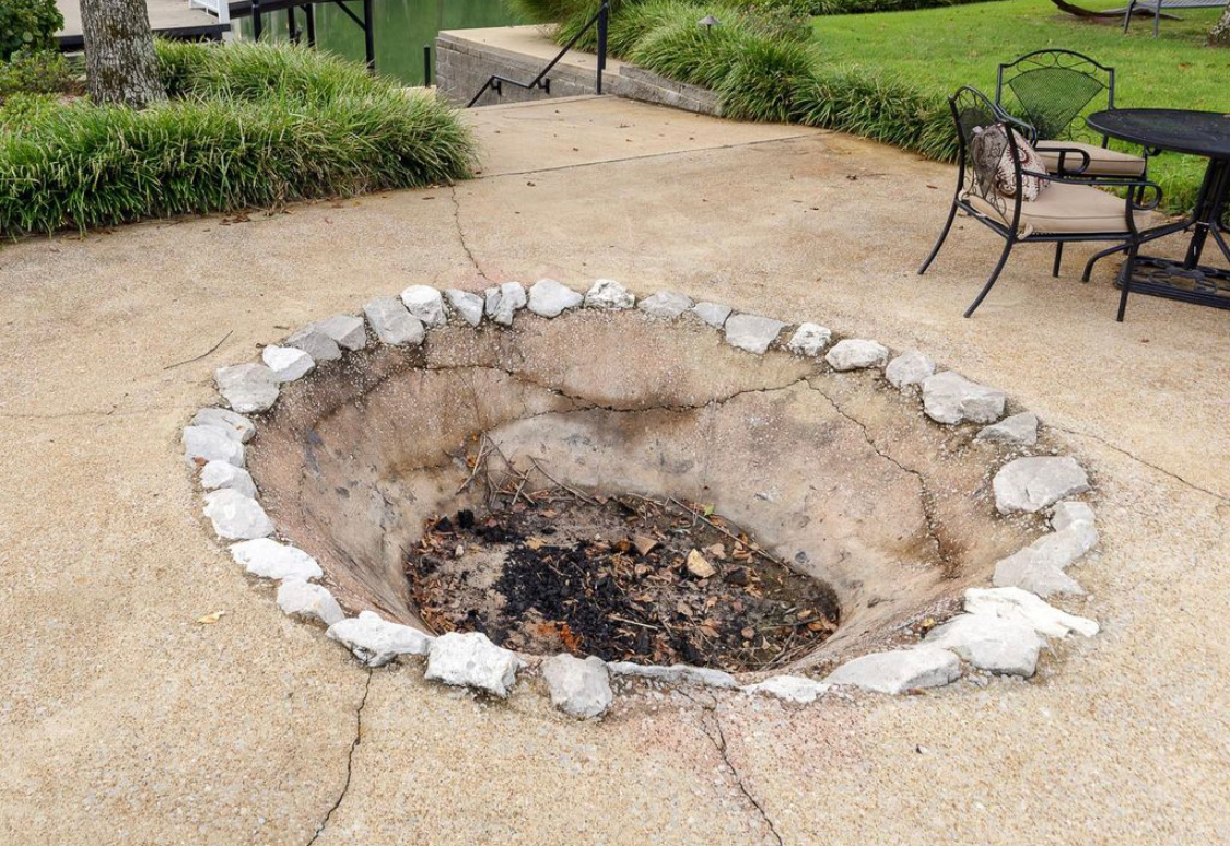 Stone fire pit in the patio near the water