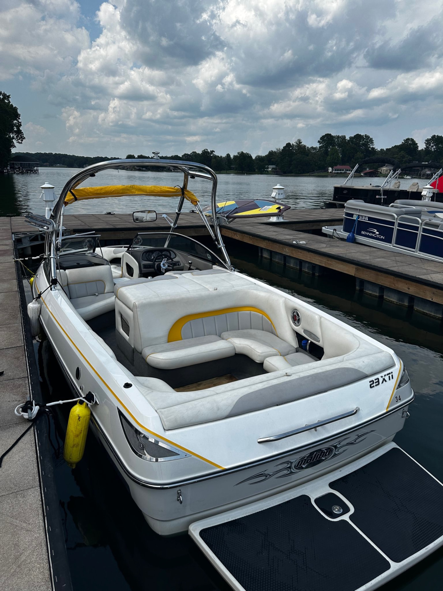 Surf boat in its slip, seen from the dock above