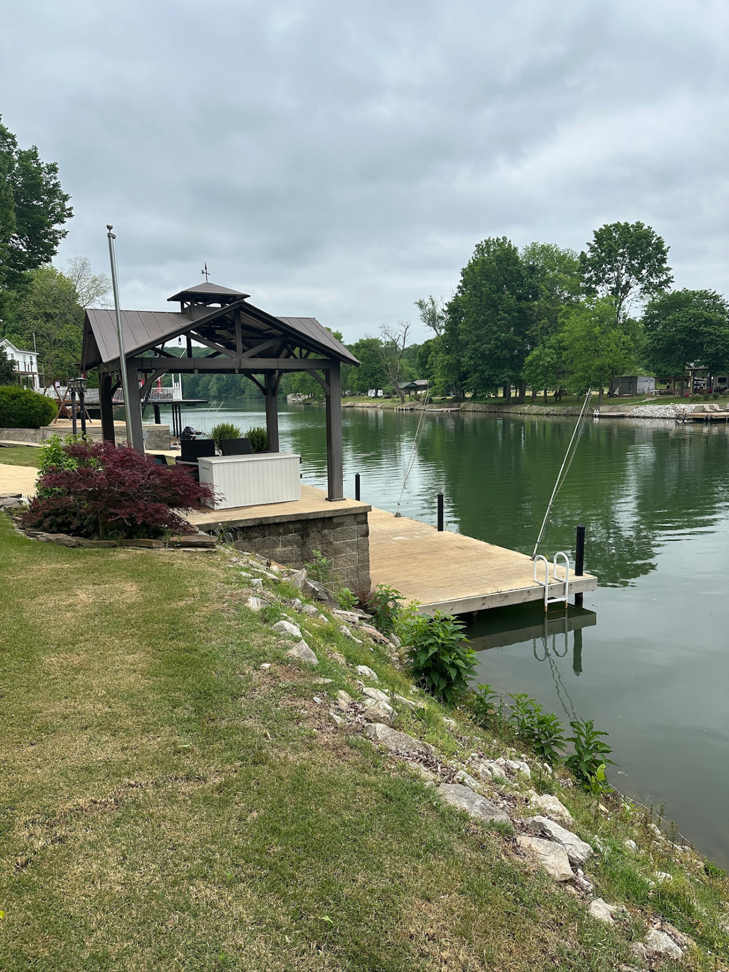 Covered dock and pier extending over the lake