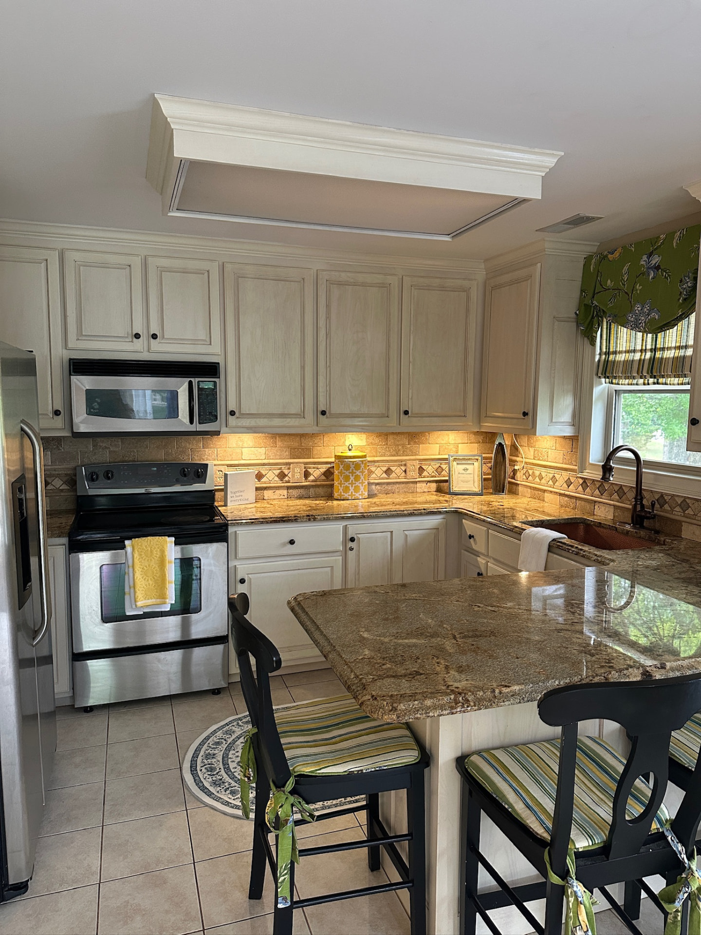 Kitchen with granite counters and breakfast bar